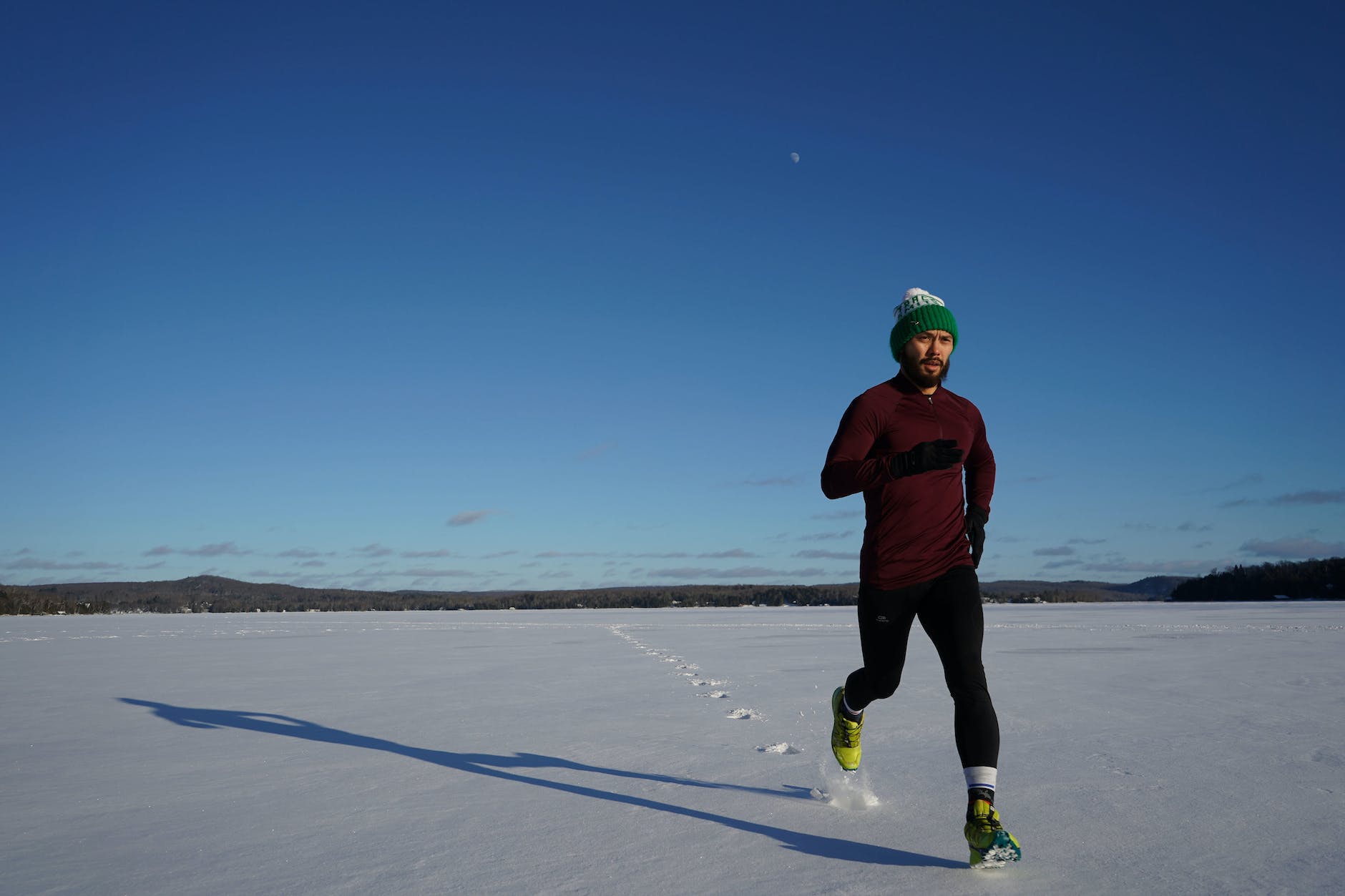 man running on ice covered land