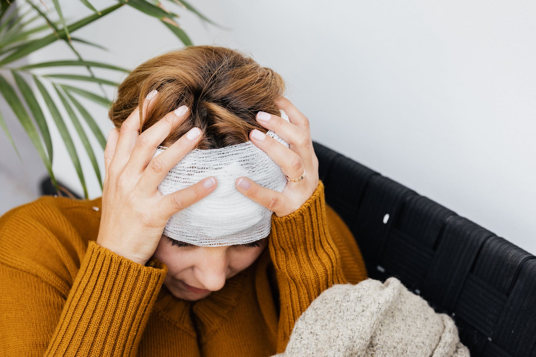 photograph of a woman with a headache